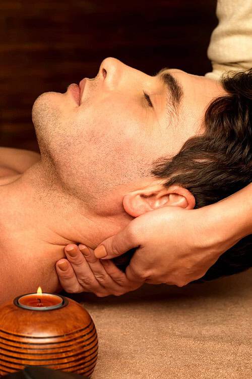 man having neck massage in the spa salon