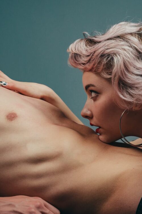 Woman leans close to man's chest
