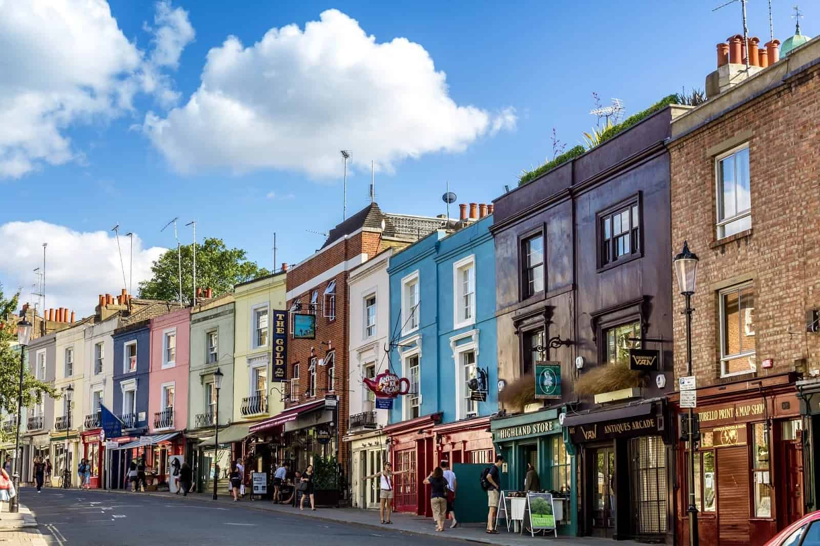 Colourful shops and homes on a vibrant London street.